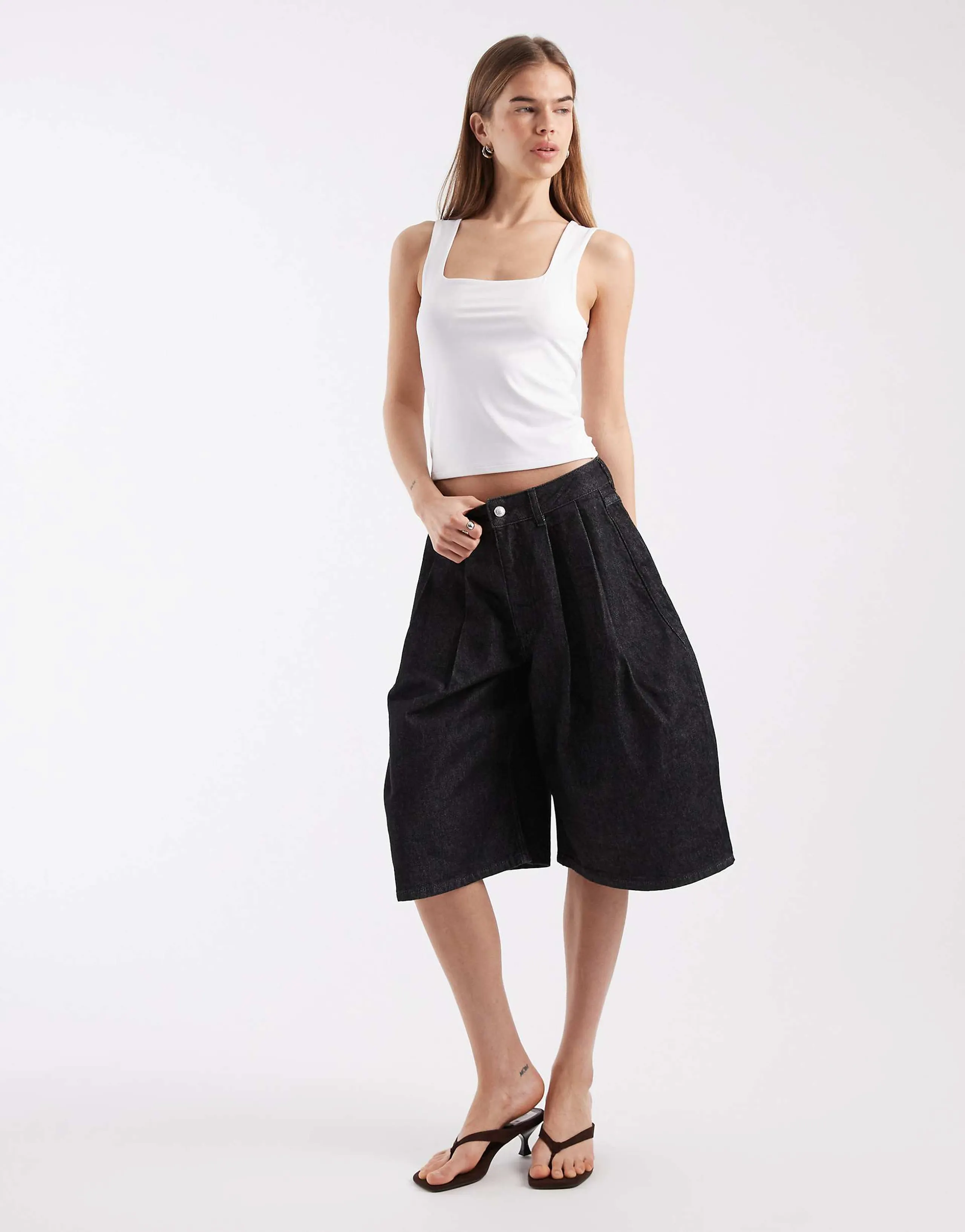 ASOS DESIGN oversized pleat bermuda shorts in black rinse