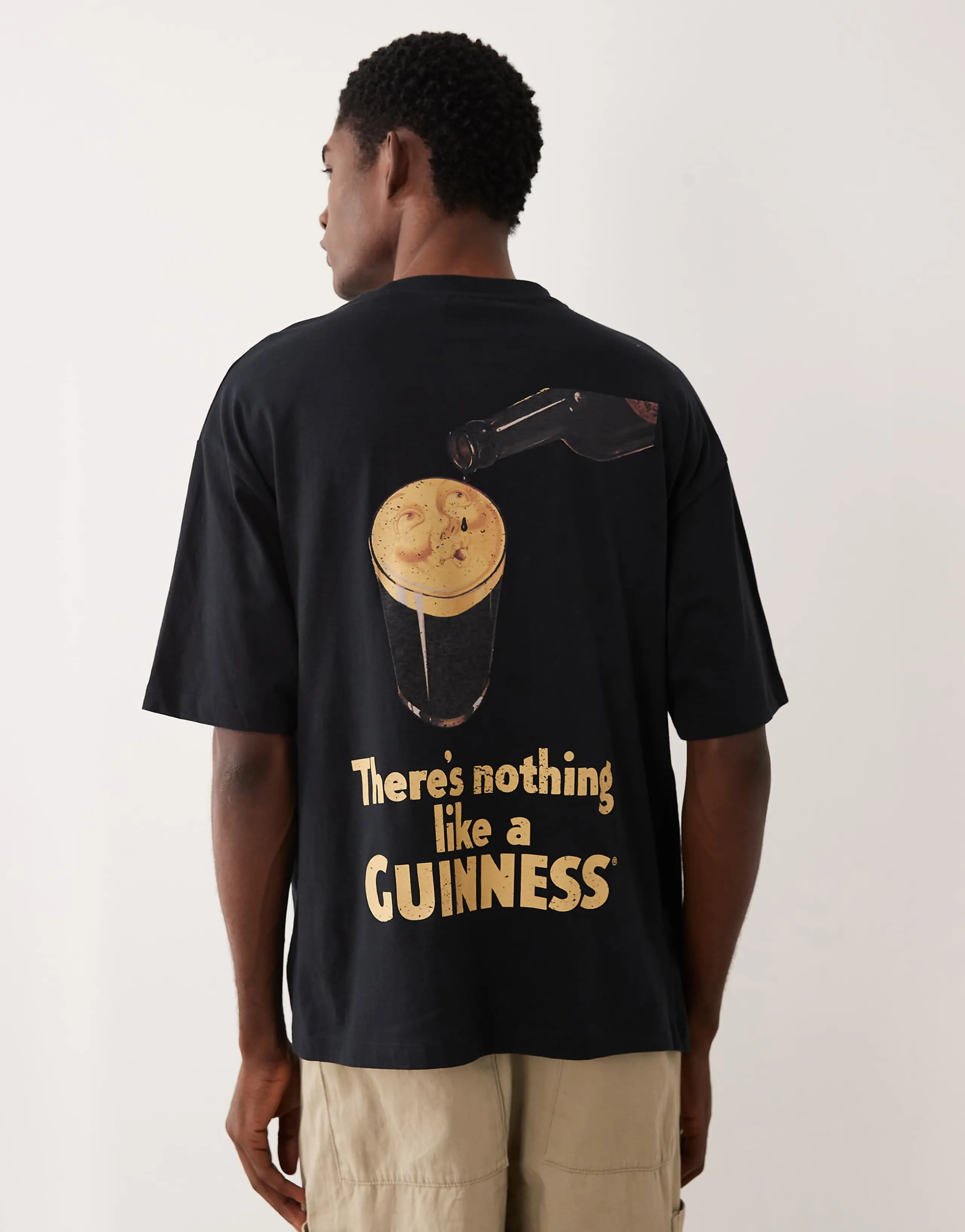 ASOS DESIGN oversized t-shirt with Guinness print in black