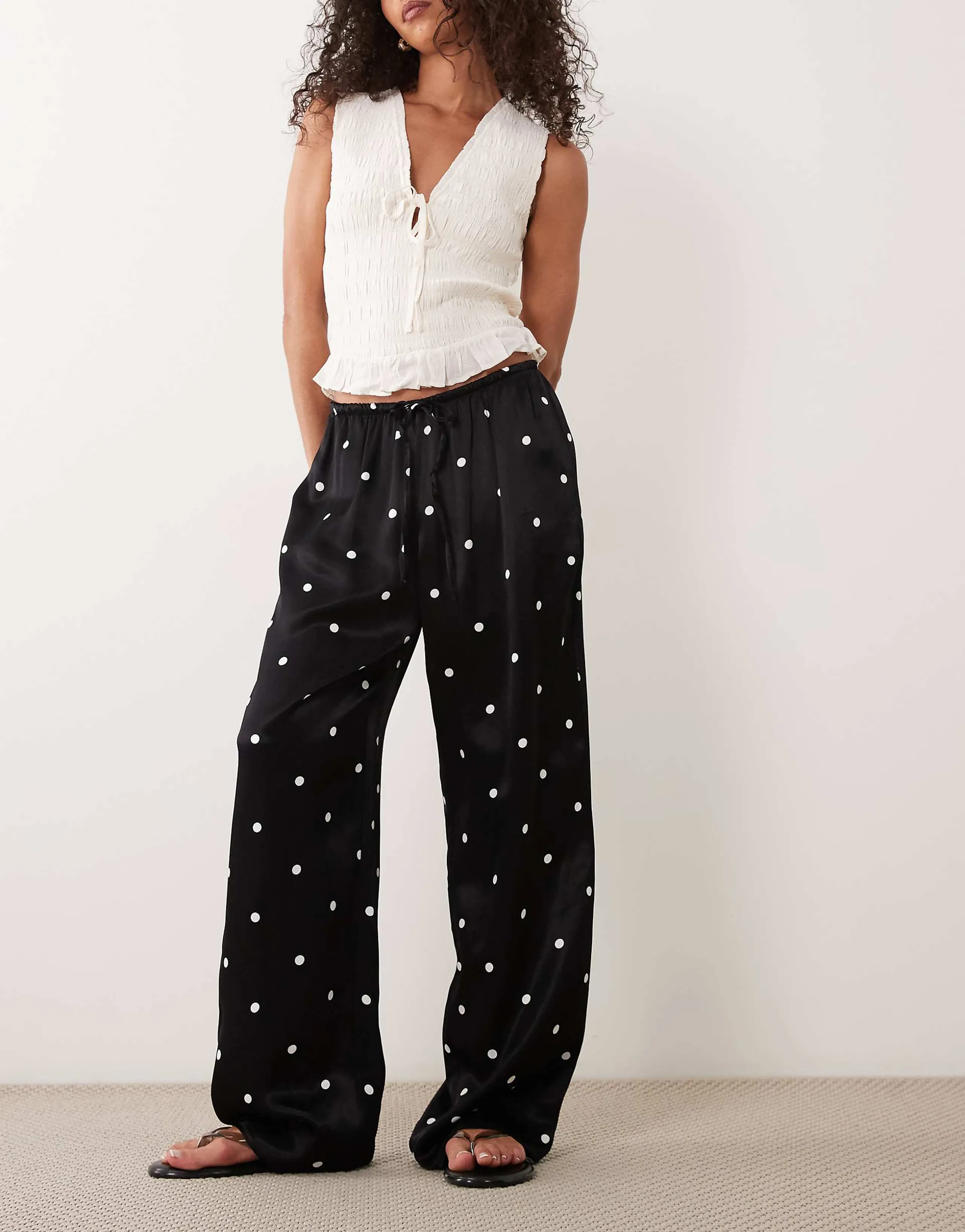 ASOS DESIGN satin wide leg pull on trousers in polka dots